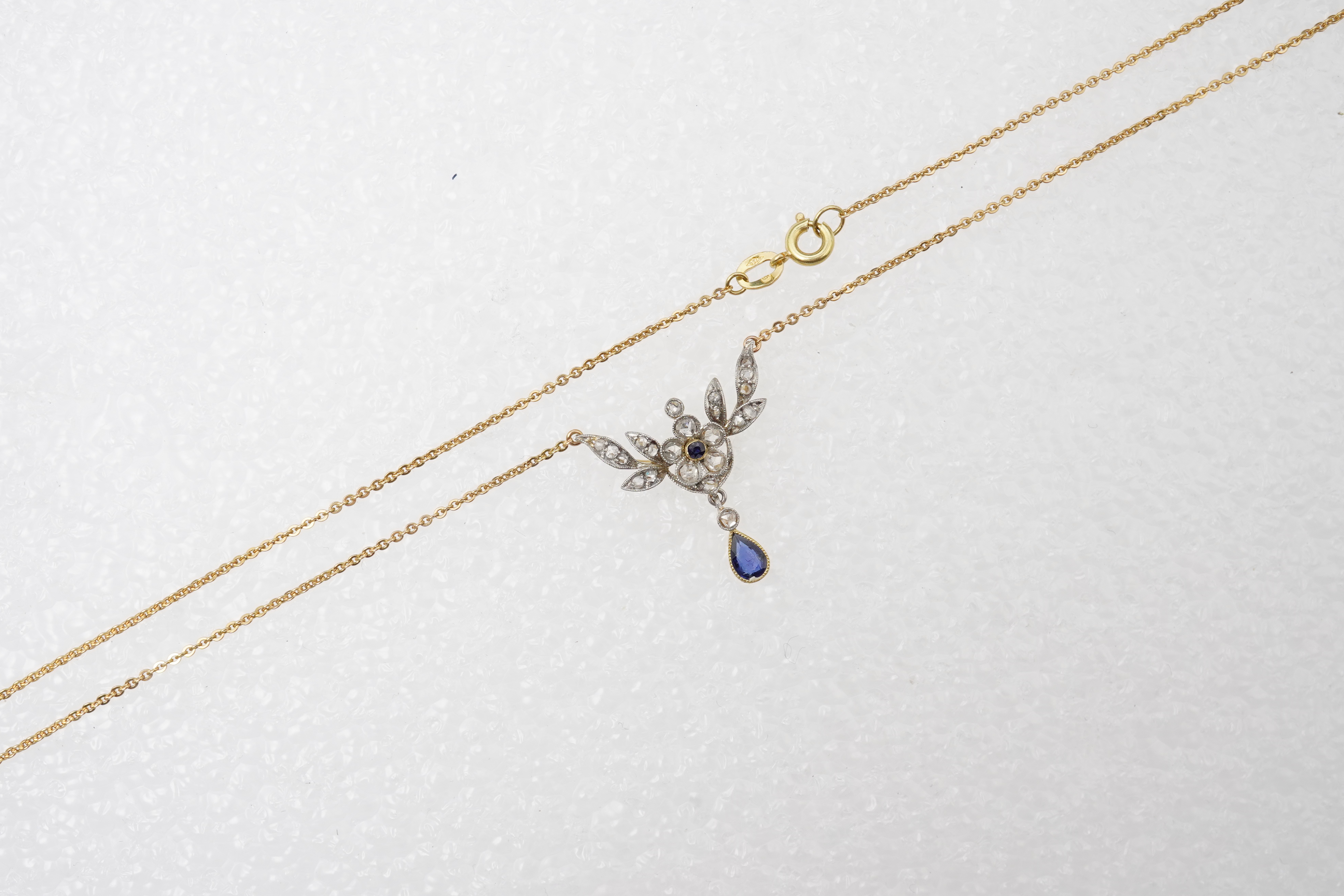 A sapphire and diamond pendant